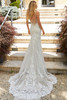 Back view of Pascha featuring open back and lace-trimmed train.