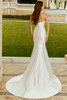 Side angle of Rhonda sheath gown with elegant satin drape.