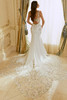 Back view of Raquel wedding gown featuring open keyhole back and chapel train.