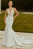 Outdoor shot of Raquel gown with fitted skirt and lace train.