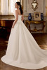 Justin Alexander London A-line wedding gown back view with princess seams and flowing satin skirt.