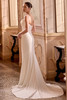 Justin Alexander Leti wedding dress side view highlighting the clean fit and flare silhouette and chapel train.