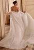 Justin Alexander Leti wedding dress shown with matching detachable cape, sold separately.