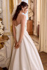 Justin Alexander Lizzie A-line wedding gown side view highlighting scattered pearl details and basque waist.