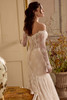 Justin Alexander Lolita mermaid wedding gown side view highlighting lace detailing and fitted silhouette.