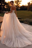 Demetrios Style 1500 wedding dress back view featuring flowing tulle skirt and elegant chapel-length train.