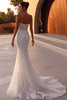 Demetrios Style 1512 wedding dress back view featuring a sleek fitted silhouette and softly flared tulle train.