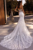 Demetrios Style 1514 wedding dress back view featuring sheer illusion back and softly flared lace train.