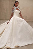 Demetrios Style 1526 wedding dress side view highlighting deep pleated skirt and structured brocade fabric.