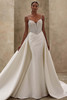 Demetrios Style 1532 flared wedding dress with pearl-encrusted bodice, spaghetti straps, and sleek draped skirt.