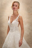 Demetrios Style 1543 wedding dress front close-up showing elegant V-neckline and light-catching embroidery.