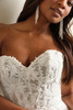 Maggie Sottero Caroline wedding gown close-up illusion bodice exposed boning lace