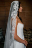 Watters Locket Nectarine wedding gown side view with lace-edged veil and wide neckline