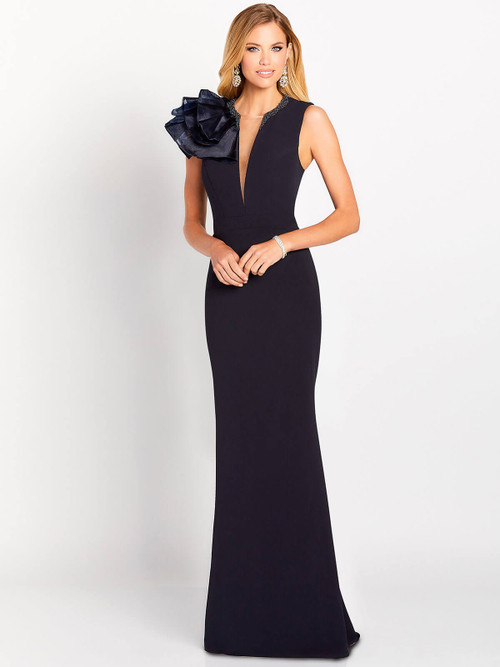 Sculpted navy gown with sheer plunge neckline and oversized shoulder flower