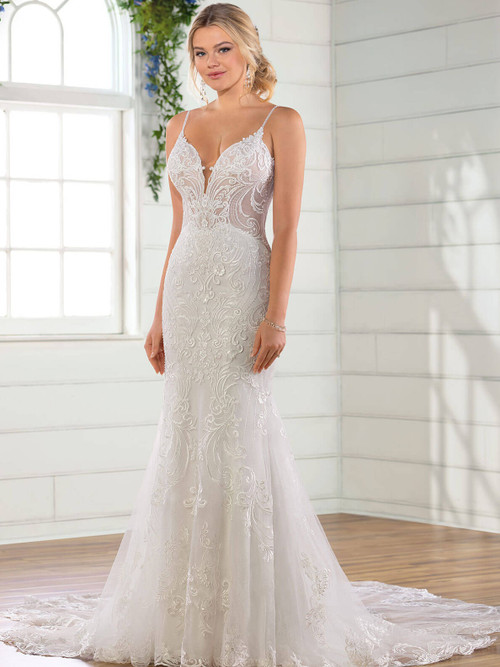 Scrollwork lace and sheer side panels highlight the sleek silhouette of this romantic fit-and-flare gown Scrollwork lace and sheer side panels highlight the sleek silhouette of this romantic fit-and-flare gown