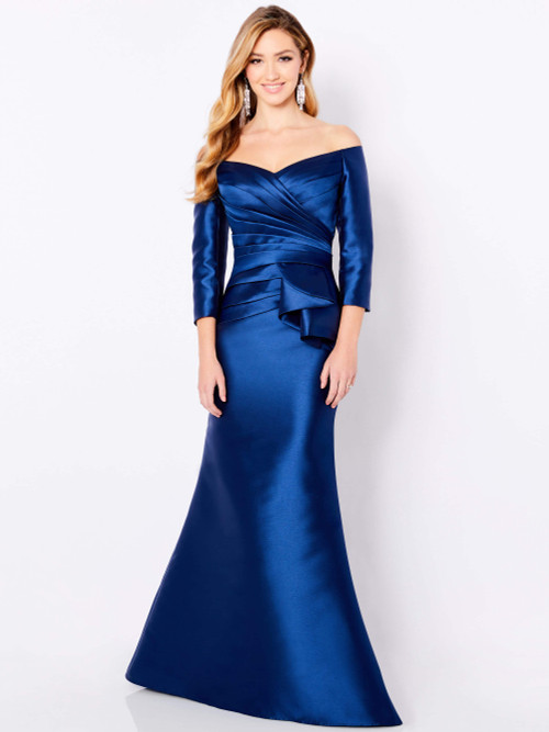 Satin navy gown with off-shoulder neckline, pleated bodice, and peplum waist detail Satin navy gown with off-shoulder neckline, pleated bodice, and peplum waist detail