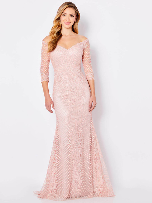 Blush embroidered gown with scalloped off-shoulder neckline and sheer sleeves Blush embroidered gown with scalloped off-shoulder neckline and sheer sleeves