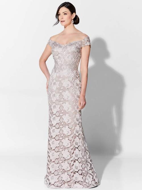 Off-shoulder rose lace gown features sculpted floral texture and a soft fluted silhouette