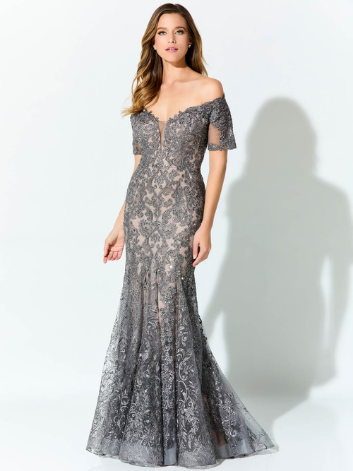 Silver lace embroidery floats over nude mesh in this off-shoulder trumpet gown Silver lace embroidery floats over nude mesh in this off-shoulder trumpet gown
