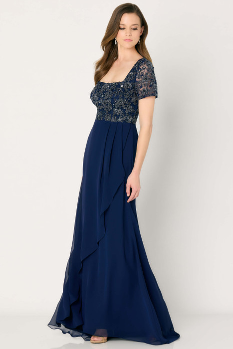 Navy gown with square neckline, sequin floral bodice, and soft chiffon drape