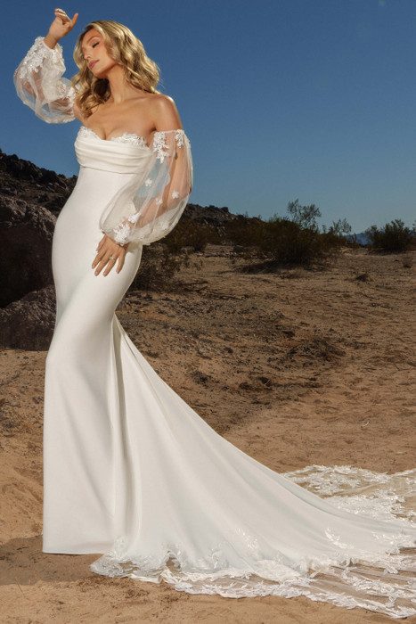 Side view of Kitty Chen Helen fitted gown with draped sweetheart neckline and detachable puff sleeves Side view of Kitty Chen Helen fitted gown with draped sweetheart neckline and detachable puff sleeves