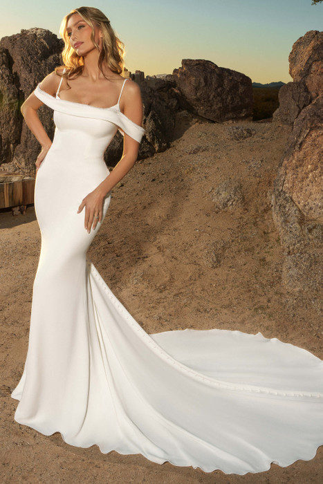 Front view of Kitty Chen Reeva fitted gown with off-shoulder neckline and sleek silhouette Front view of Kitty Chen Reeva fitted gown with off-shoulder neckline and sleek silhouette