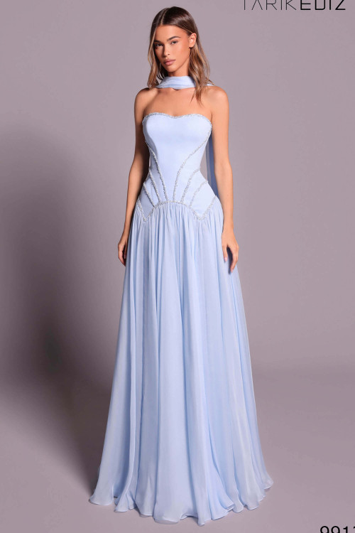 Front view of blue aura Tarik Ediz Blance evening gown with beaded waist