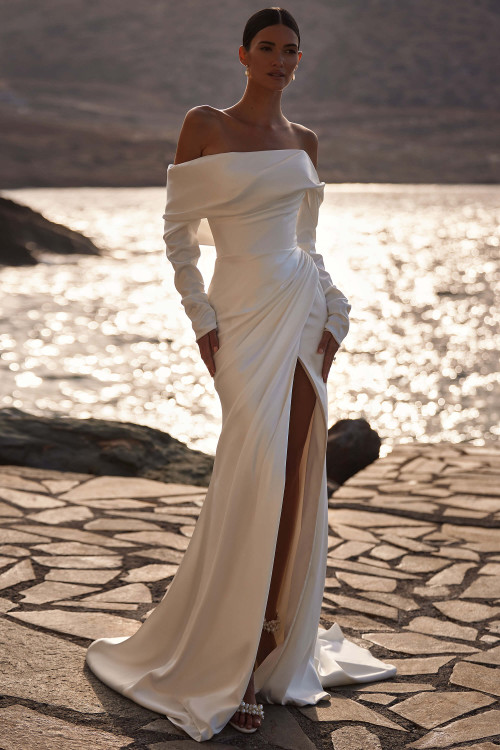 Front view of Milla Nova Bellissima satin sheath wedding dress with off-the-shoulder bolero