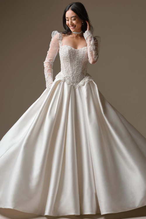 Front view of Maggie Sottero London satin ball gown with long beaded lace sleeves