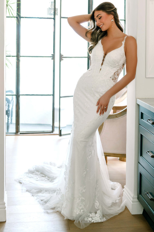Stella York SY8168 fit-and-flare wedding dress with plunging sweetheart neckline and lace appliqués
