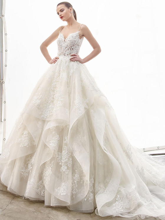 Lace bodice crowns a tiered ballgown skirt with cascading layers and floral embroidery Lace bodice crowns a tiered ballgown skirt with cascading layers and floral embroidery