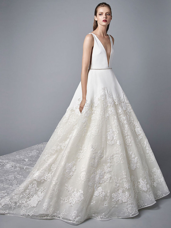 Deep-V bodice meets lace ballgown skirt, finished with jeweled belt and sweeping train Deep-V bodice meets lace ballgown skirt, finished with jeweled belt and sweeping train
