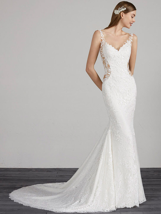 Fit-and-flare lace gown with illusion side cutouts, floral appliqués, and a scalloped train Fit-and-flare lace gown with illusion side cutouts, floral appliqués, and a scalloped train