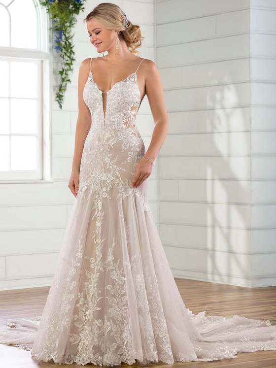 Floral lace and a plunging illusion neckline enhance the soft elegance of this fit-and-flare gown Floral lace and a plunging illusion neckline enhance the soft elegance of this fit-and-flare gown