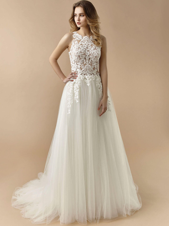 Illusion lace bodice pairs with a soft tulle skirt in this dreamy A-line bridal gown Illusion lace bodice pairs with a soft tulle skirt in this dreamy A-line bridal gown
