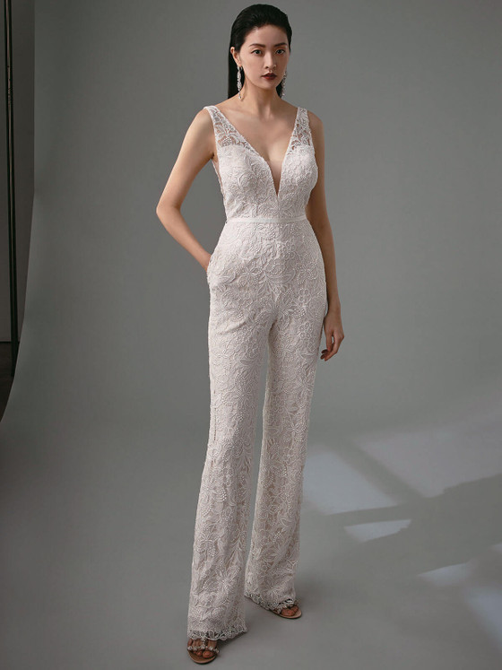 Chic lace bridal jumpsuit features a plunging neckline, tailored waist, and wide-leg silhouette Chic lace bridal jumpsuit features a plunging neckline, tailored waist, and wide-leg silhouette