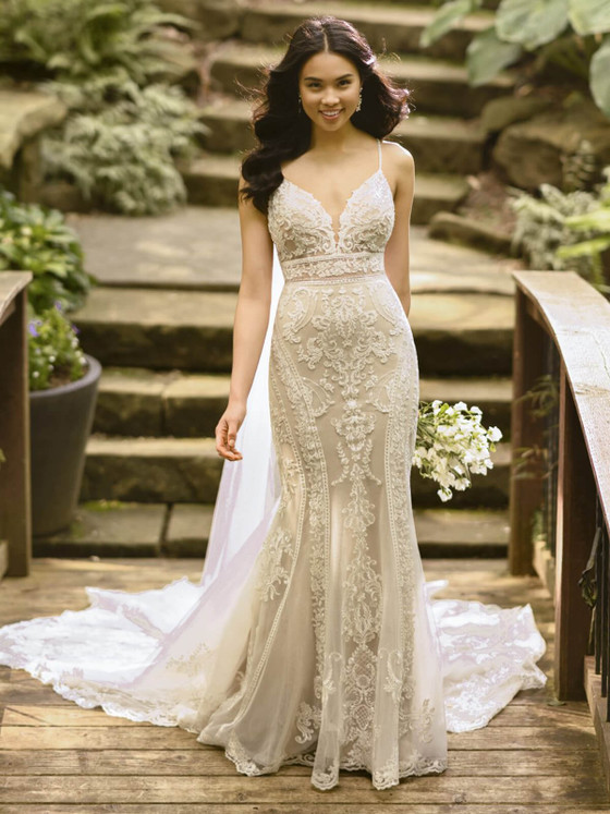 Intricate scroll lace and a sculpted silhouette make this gown a timeless, elegant showstopper Intricate scroll lace and a sculpted silhouette make this gown a timeless, elegant showstopper