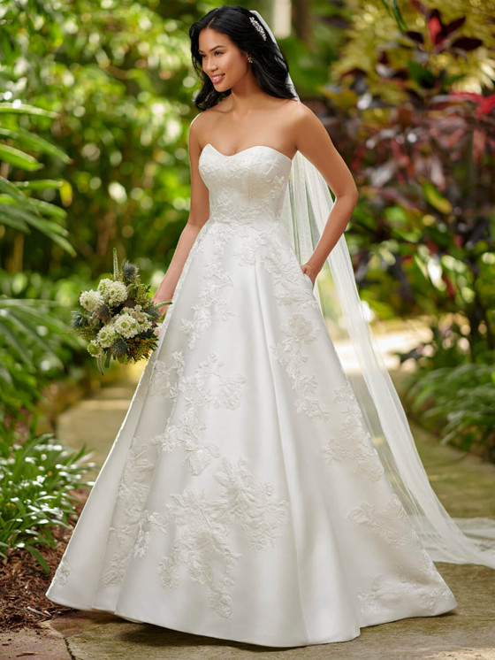 Elegant satin A-line gown features a strapless neckline and soft floral embroidery for timeless charm Elegant satin A-line gown features a strapless neckline and soft floral embroidery for timeless charm