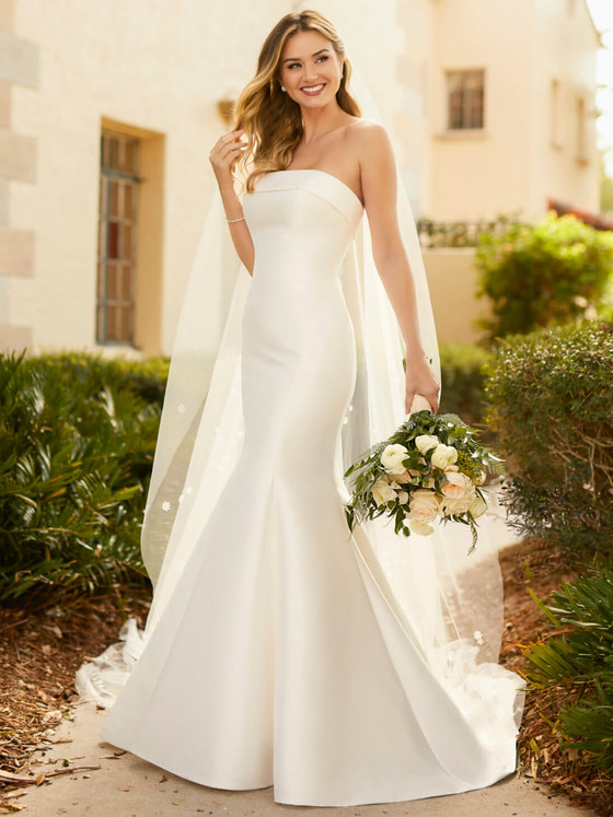 Sleek satin mermaid gown with modern strapless neckline and structured bodice Sleek satin mermaid gown with modern strapless neckline and structured bodice