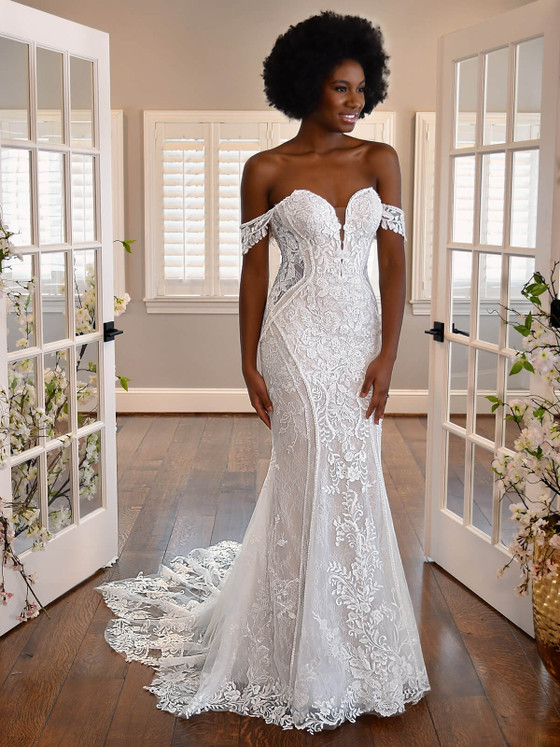 Romantic off-the-shoulder lace meets a sculpted silhouette and dramatic scalloped train Romantic off-the-shoulder lace meets a sculpted silhouette and dramatic scalloped train