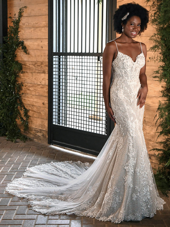 Fit for a queen, this beaded lace gown hugs every curve and finishes with a dramatic cathedral train Fit for a queen, this beaded lace gown hugs every curve and finishes with a dramatic cathedral train