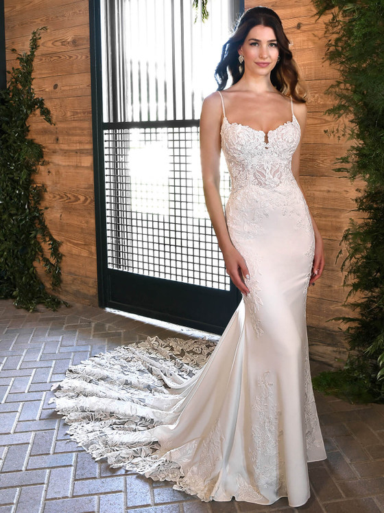 This curve-hugging gown dazzles with floral lace, spaghetti straps, and a breathtaking illusion train This curve-hugging gown dazzles with floral lace, spaghetti straps, and a breathtaking illusion train