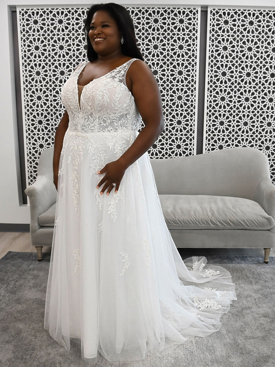 Plunging lace bodice with sparkle tulle skirt and flattering A-line silhouette Plunging lace bodice with sparkle tulle skirt and flattering A-line silhouette