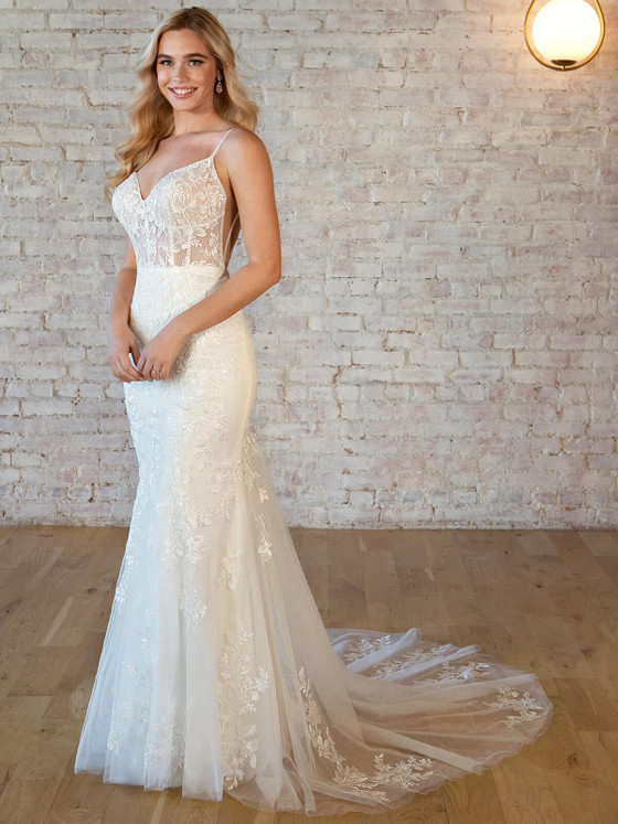 Sheer lace bodice with a fitted sparkle tulle skirt and delicate spaghetti straps Sheer lace bodice with a fitted sparkle tulle skirt and delicate spaghetti straps