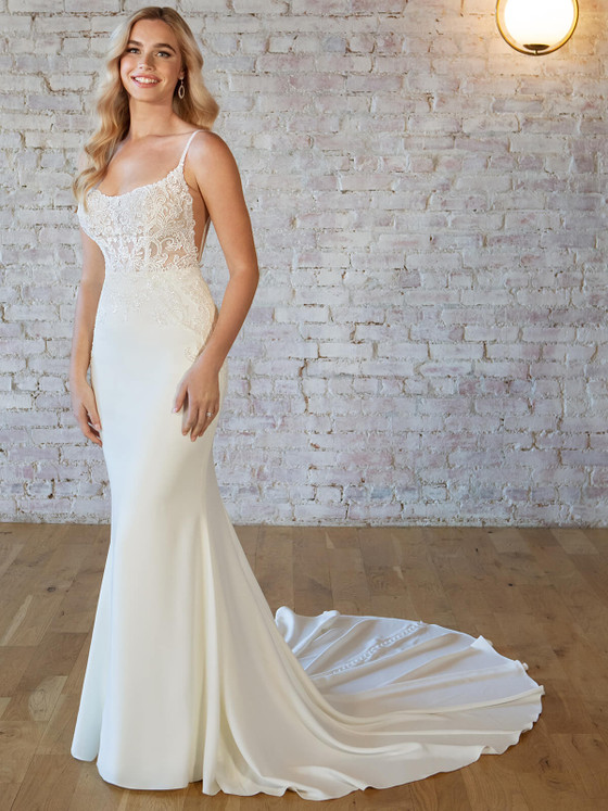 Sheer lace bodice with spaghetti straps and sleek fitted crepe skirt Sheer lace bodice with spaghetti straps and sleek fitted crepe skirt