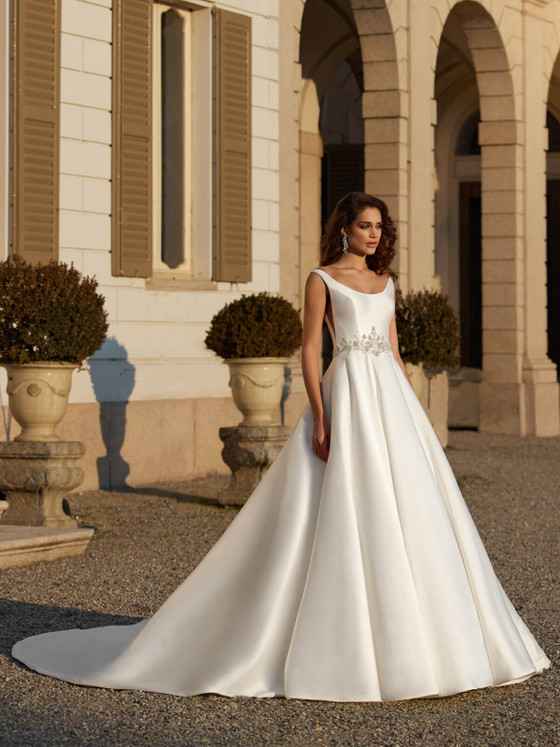 Classic satin ballgown with a scoop neckline and jeweled waist detail for timeless elegance Classic satin ballgown with a scoop neckline and jeweled waist detail for timeless elegance
