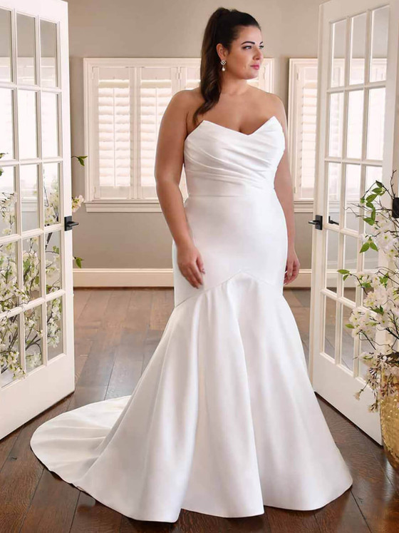 A draped sweetheart neckline and clean fit-and-flare silhouette define this chic satin bridal gown A draped sweetheart neckline and clean fit-and-flare silhouette define this chic satin bridal gown