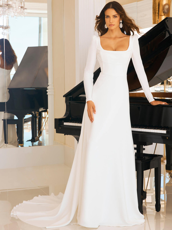 Elegant crepe gown with long puffed sleeves, a square neckline, and a flowing chapel train for timeless sophistication Elegant crepe gown with long puffed sleeves, a square neckline, and a flowing chapel train for timeless sophistication