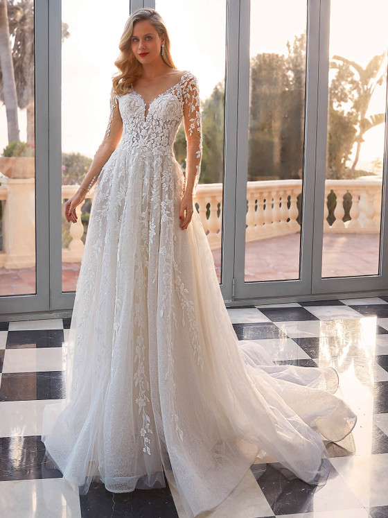 Image of model wearing a bridal gown. Dimitra Designs, an authorized bridal shop in Greenville SC Image of model wearing a bridal gown. Dimitra Designs, an authorized bridal shop in Greenville SC