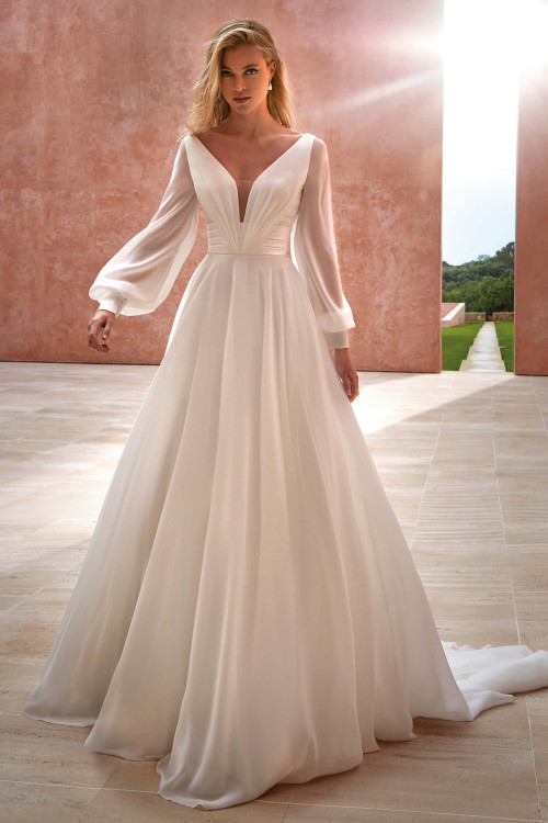 Romantic chiffon gown with a deep V-neckline, ruched waist, and detachable airy bishop sleeves Romantic chiffon gown with a deep V-neckline, ruched waist, and detachable airy bishop sleeves
